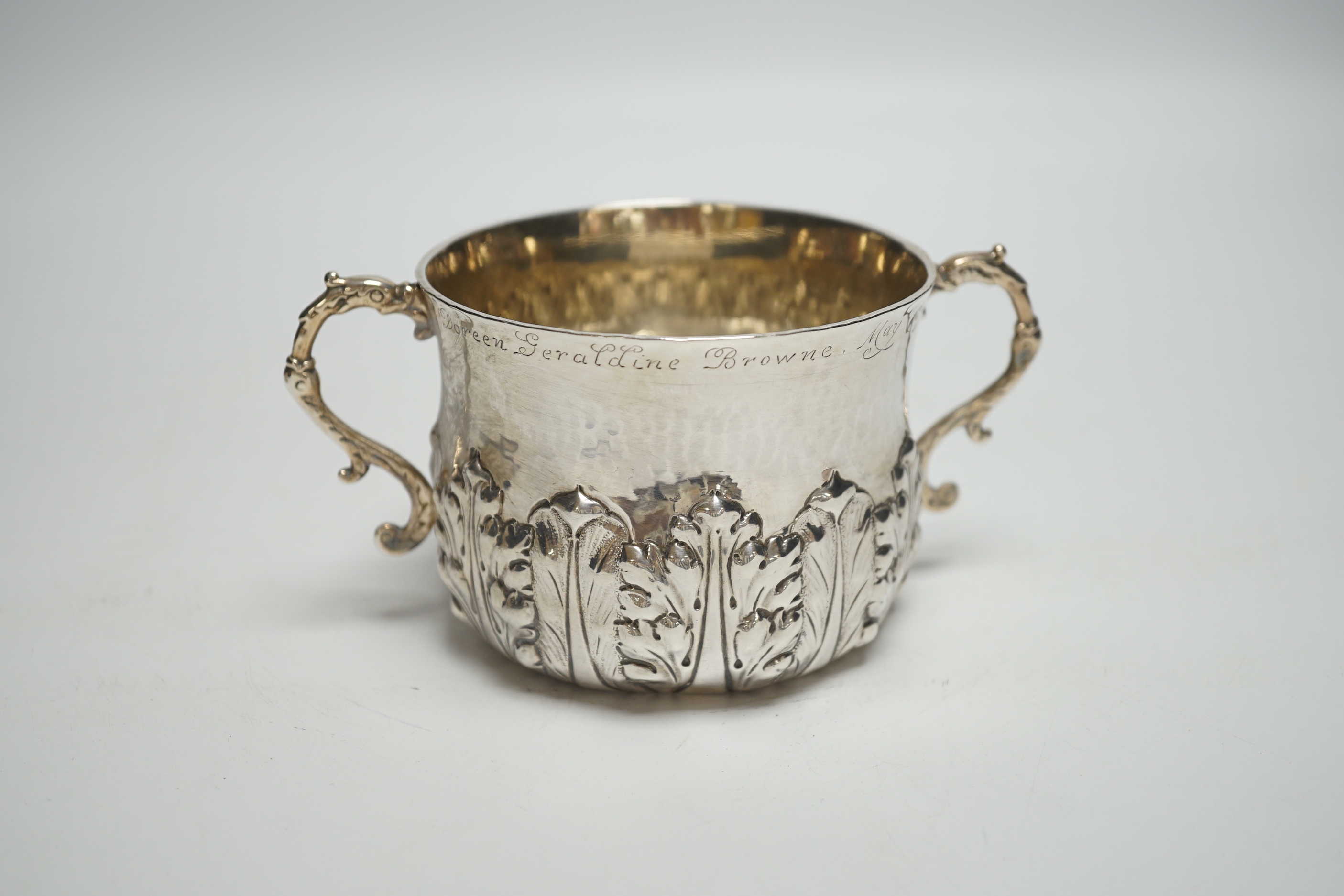 A late Victorian Britannia standard silver porringer with foliate decoration, Lambert & Co, London, 1895, with engraved inscription, 5.7oz.